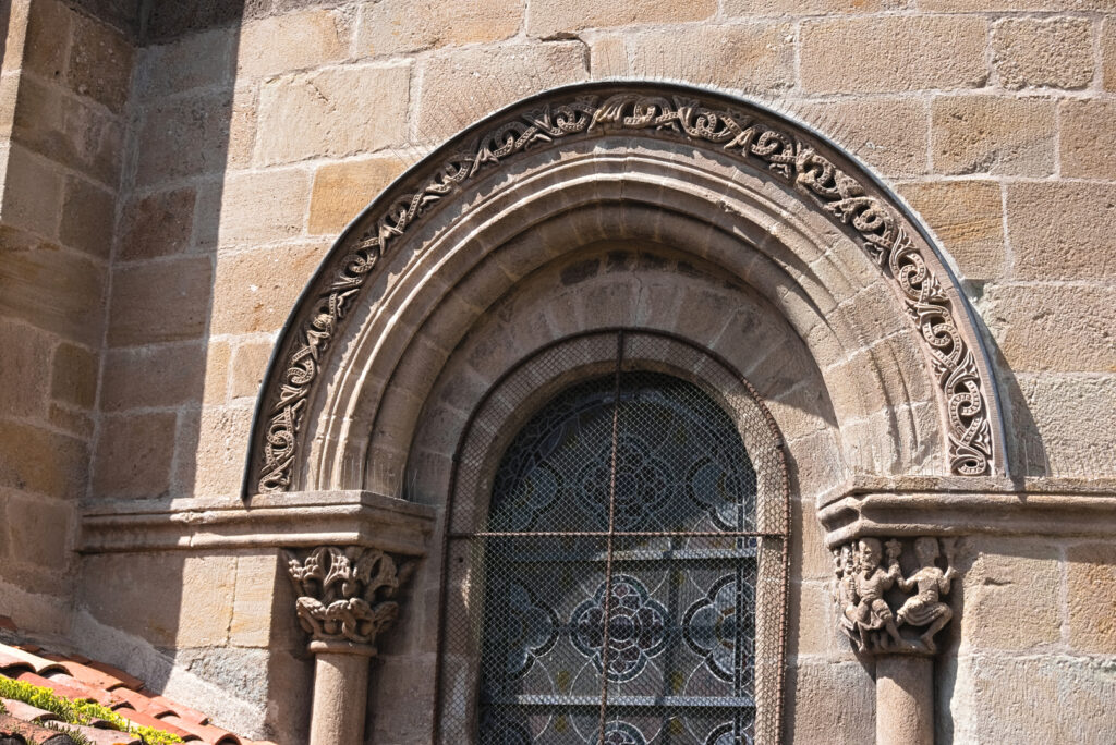 Very detailed tympanum with a foilage knotwork over one of te windows